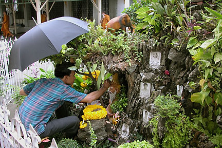 Artist working on a shrine at Wat Chana Sogngkhram in Banglampoo